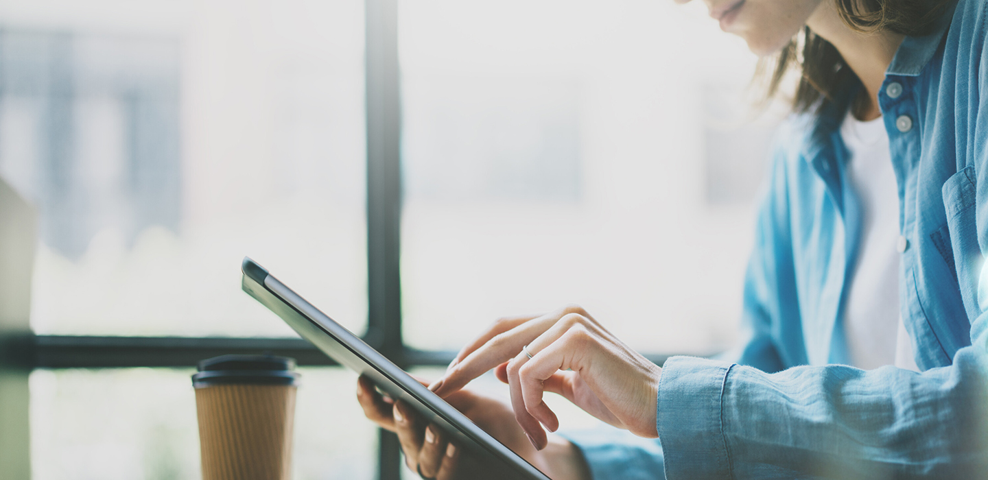 Picture of a bank customer on a tablet.